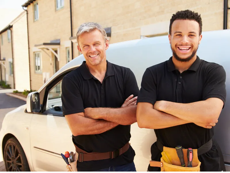 Heating Engineers Standing by van